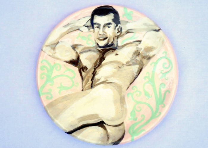 Strong man posing small tea plate